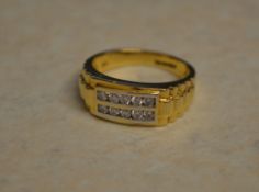 18ct gold diamond ring with 10 central small diamonds arranged in two rows of 5, approx 0.