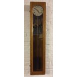 Electric Post Office style regulator wall clock in an oak case
