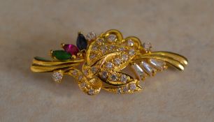 18ct gold brooch marked '750' with gemstones including sapphire, ruby,