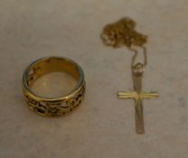 Yellow metal ring and a 9ct gold chain with yellow metal cross