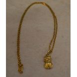 Oriental tested as 15ct gold necklace with a tested as 9ct gold pendant in the shape of a small cat,