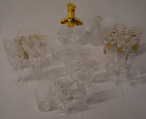 Glassware including a L'Or cognac bottle,