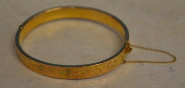 9ct gold bangle with safety chain, approx weight 9.