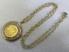 George IV full sovereign 1912 with a 9ct gold mount (tested as) and a 9ct gold chain total weight