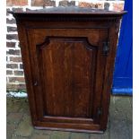 Georgian oak corner cupboard with shaped shelves & two drawers