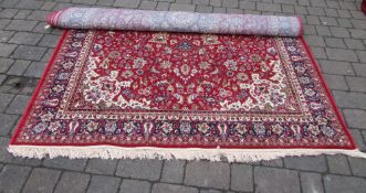 Red ground Kashmir carpet with floral medallion design