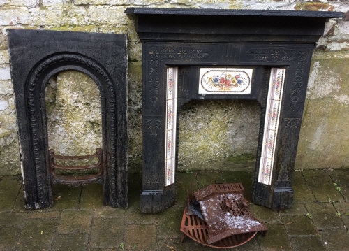 Cast iron & tiled fire surround & a cast iron insert