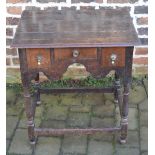 Small oak Georgian lowboy with cross banding to the drawers on turned legs H 71cm W67cm D53cm.