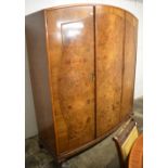 Burr walnut veneer bow fronted triple wardrobe,