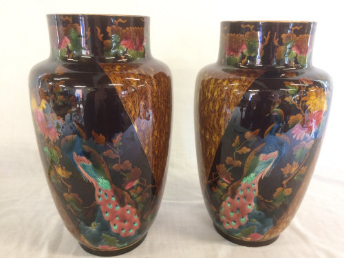 Pair of heavily glazed vases decorated with peacocks H30cm