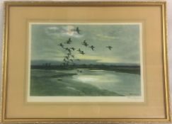 Framed print 'Wigeons beyond the dunes' signed in pencil by the artist Peter Scott.