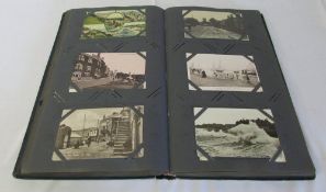 Postcard album containing photographic and topographical cards