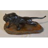 Figure on base of a roaring tiger