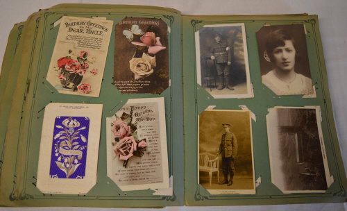 A large postcard album with good quality cards, including militaria, topographical,