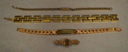 3 yellow metal bracelets and an unmarked brooch (AF)