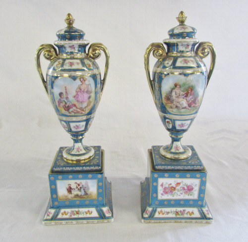 Pair of Sevres style vases with decorated panels H 30 cm
