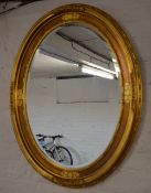 Oval gilt framed mirror with bevelled glass