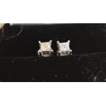 Pair of stud earrings marked 10k