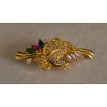 18ct gold brooch marked '750' with gemstones including sapphire, ruby,