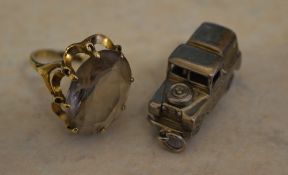 9ct gold dress ring and a silver charm in the shape of a Land Rover