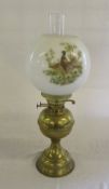 Brass paraffin lamp with glass shade