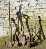 Various garden tools including spades,