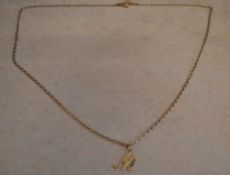 9ct gold pendant in the shape of the letter 'M' on 9ct gold chain, approx weight 3.