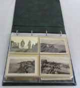 Green postcard album containing real photographic,