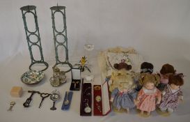 Various dolls, candlesticks, linen,