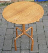 An unusual occasional table on quad legs,