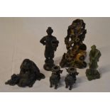 Various candlesticks and figures including soapstone