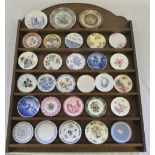 Miniature collectors plates with wooden stand inc Spode, Royal Doulton, Wedgwood,