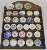 Miniature collectors plates with wooden stand inc Spode, Royal Doulton, Wedgwood,