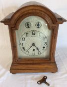 Early 20th century oak cased domed top mantel clock