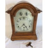 Early 20th century oak cased domed top mantel clock