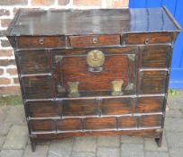 Oriental cabinet with 3 drawers over cupboard with ring handles,