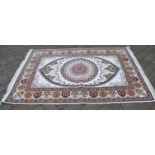 Ivory ground woven silk rug with a Shabaz medallion design,