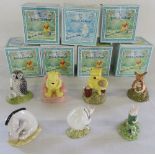 7 Royal Doulton Winnie the Pooh figures inc Piglet picking violets,