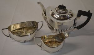 Silver tea set comprising of teapot, sugar bowl and milk jug with part gadrooned body,