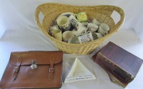 Wicker basket containing commemorative ware, satchel, ashtray,