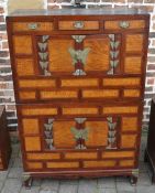 Oriental chest on chest with swan neck style handles and butterfly hinge decoration,