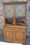 A superior mahogany display bookcase in the Chippendale style with blind fret work to the pelmet &