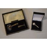 Silver Christening set (Birmingham 1958) and a silver miniature pair of shell shaped tongs (London