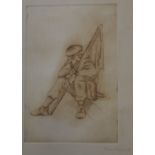 Framed etching of a man sat holding a flag