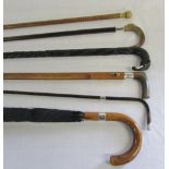 Various silver cuffed walking sticks,