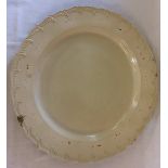 Large 18th century salt glazed charger with barbed border Dia.34cm Chip to rim.