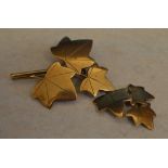 9ct gold bar brooch in the shape of trailing ivy,