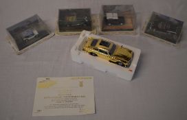 4 James Bond die cast model cars and a Danbury Mint 22ct gold plated 007 Aston Martin DB5