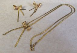 Tested as 9ct gold bow design necklace and earrings set total weight 4.