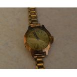 9ct gold ladies wristwatch (body only) on a rolled gold strap